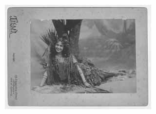 May Moore Duprez posing in front of a tree. Image © The May Moore Duprez Archive
